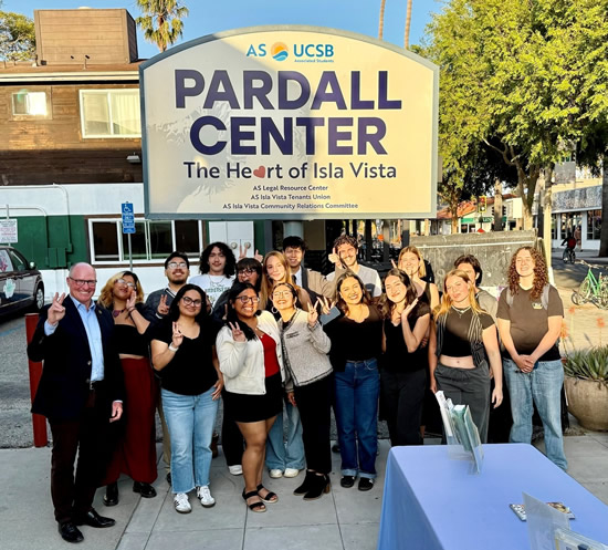 Asm. Hart with group of UCSB students in front of sign