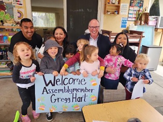 Group photo of Asm. Hart with children and childcare providers