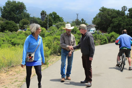 Asm. Hart shaking hands with constituent on hike