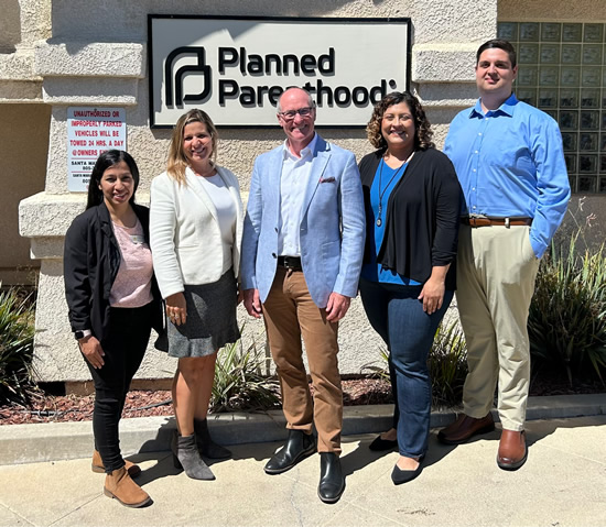 Asm. Hart posing with Planned Parenthood staff