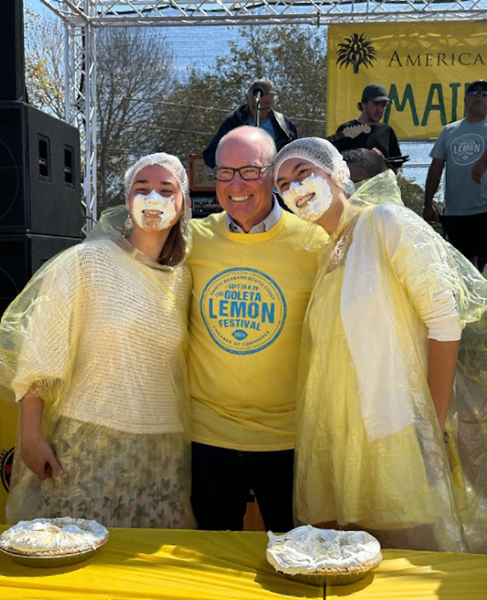 Asm. Hart with two pie eating contestants with whipped cream on their faces