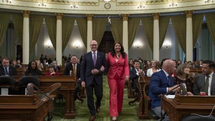 Asm. Hart escorting Terri Maus-Nisich on the Assembly Floor