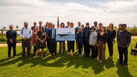 Group photo of Asm. Hart, guest speakers and other attendees